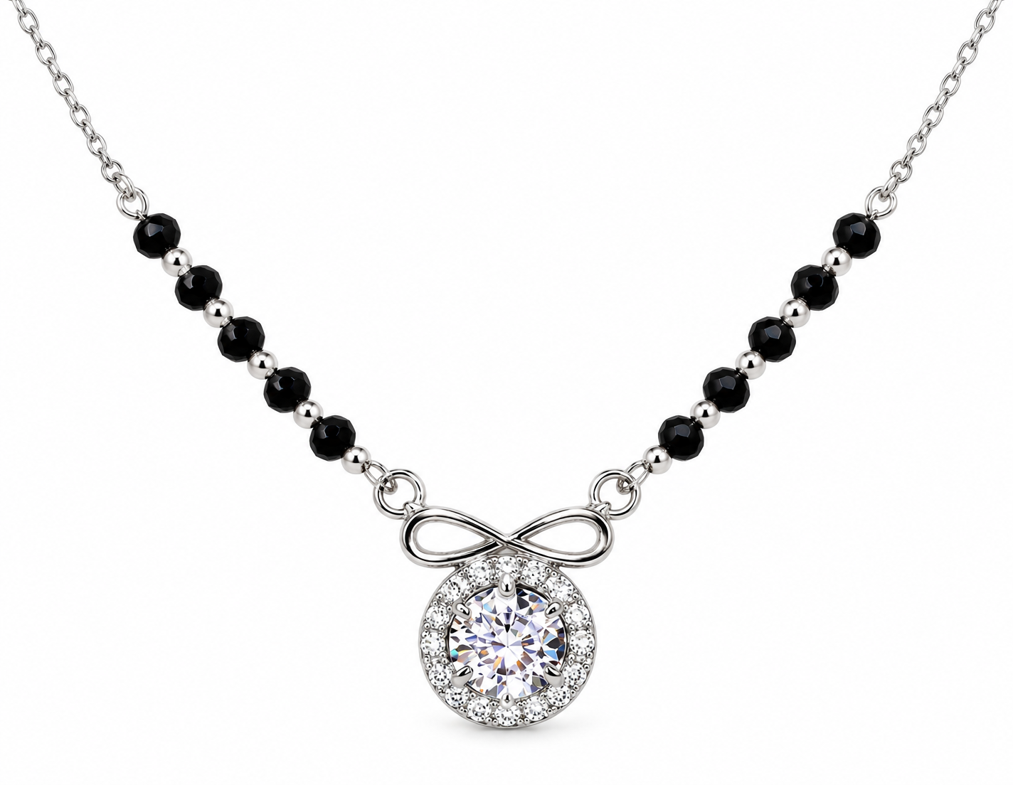 Mohnaa Anaya 925 sterling silver mangalsutra featuring an infinity-inspired bow detail, round sparkling halo pendant, and faceted black-bead chain on a white background.