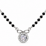 Mohnaa Anaya 925 sterling silver mangalsutra featuring an infinity-inspired bow detail, round sparkling halo pendant, and faceted black-bead chain on a white background.