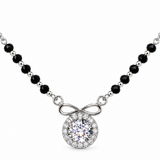 Mohnaa Anaya 925 sterling silver mangalsutra featuring an infinity-inspired bow detail, round sparkling halo pendant, and faceted black-bead chain on a white background.