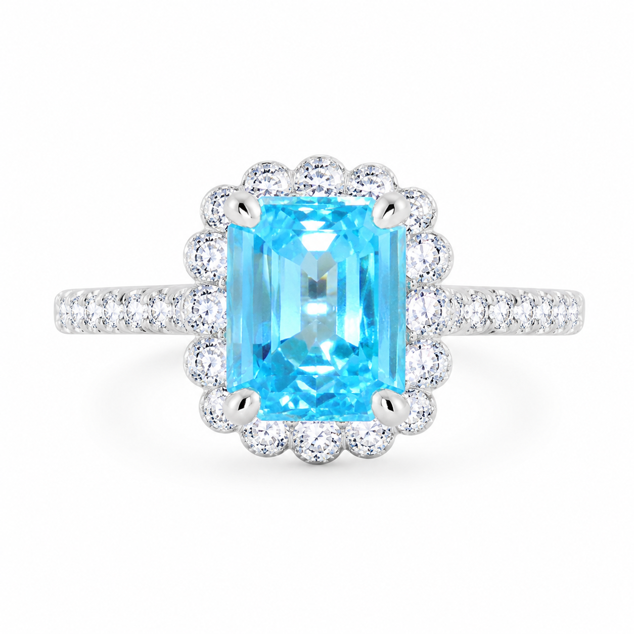 925 sterling silver ring with emerald-cut blue AAA+ cubic zirconia and sparkling CZ halo from the Ira Collection.