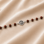 Shubhank Rudraksha Bracelet crafted in 925 sterling silver with natural Rudraksha beads and a sacred Swastik centerpiece from the Virasat Collection by Mohnaa Jewels.
