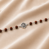Shubhank Rudraksha Bracelet crafted in 925 sterling silver with natural Rudraksha beads and a sacred Swastik centerpiece from the Virasat Collection by Mohnaa Jewels.