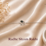 Radhe Shyam Rakhi in 925 sterling silver featuring a Radhe script motif with colorful peacock feather design and adjustable silver chain by Mohnaa Jewels.