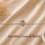 Aaradhya Ganesh Rakhi in 925 sterling silver featuring an enamel Lord Ganesha motif with adjustable silver chain by Mohnaa Jewels.
