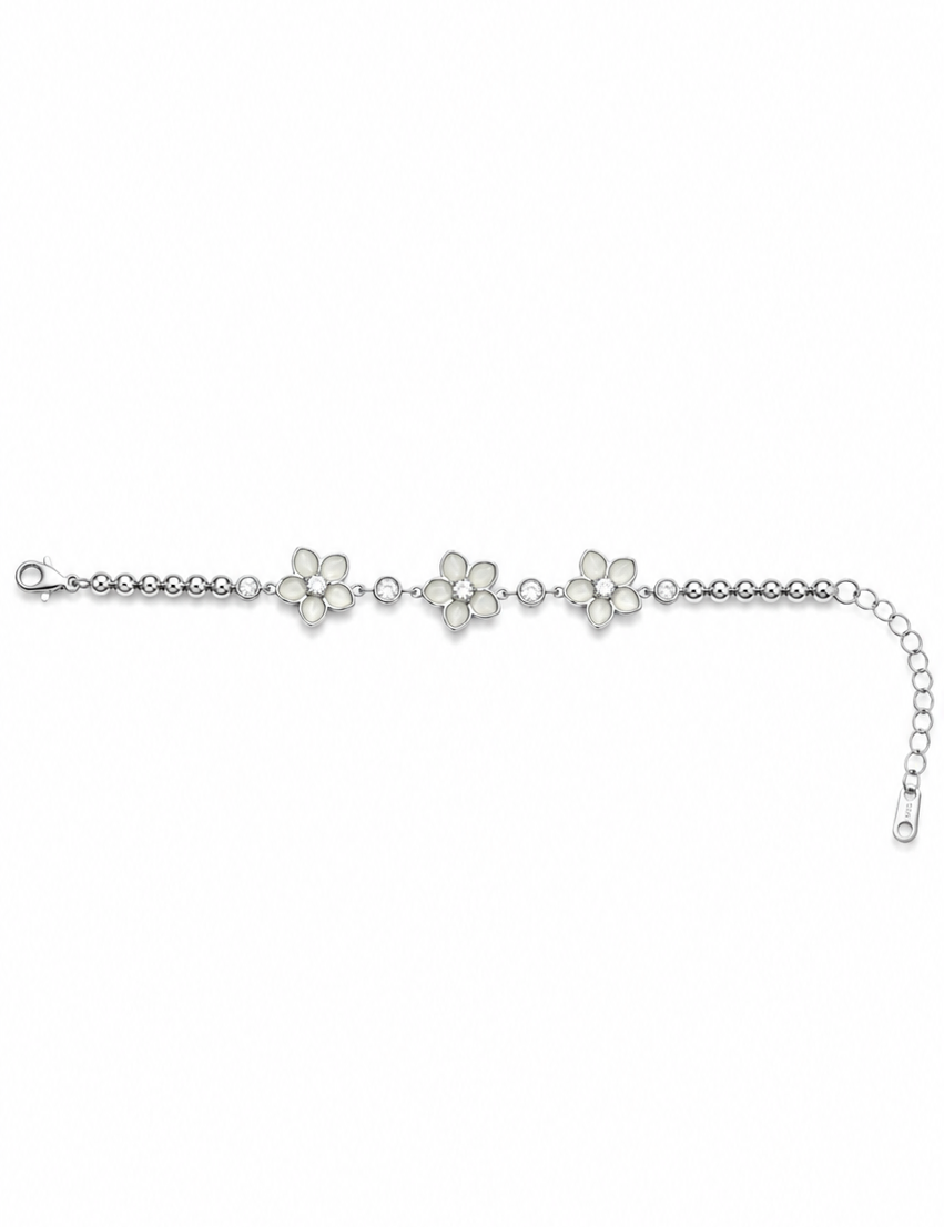 Moonlit Blossom 925 sterling silver bracelet featuring three floral motifs with sparkling AAA cubic zirconia stones and an adjustable chain, elegantly displayed on a luxurious beige satin background.