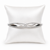 IRA Infinity Grace Bracelet in 925 sterling silver featuring an elegant infinity-inspired design with sparkling AAA+ cubic zirconia stones on a premium white display cushion.