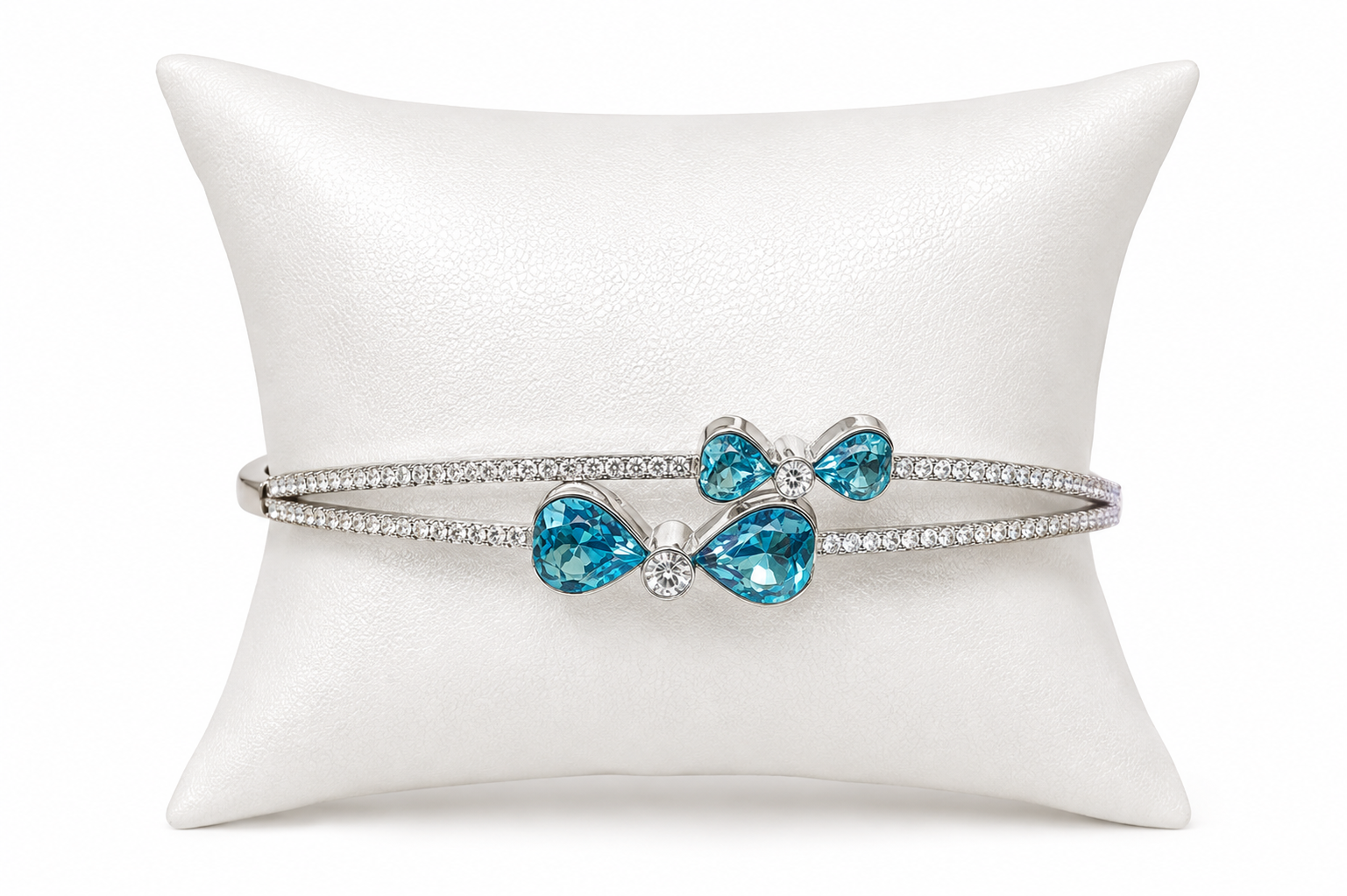 IRA Azure Bloom Bracelet crafted in 925 sterling silver featuring sparkling blue pear-cut stones, floral-inspired detailing, and brilliant CZ accents.