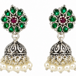 Mohnaa Harini Silver Jhumka Earrings crafted in 925 sterling silver featuring green and ruby pink cubic zirconia accents, floral stud design and traditional jhumka styling.