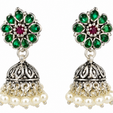 Mohnaa Harini Silver Jhumka Earrings crafted in 925 sterling silver featuring green and ruby pink cubic zirconia accents, floral stud design and traditional jhumka styling.