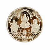 Round silver coin featuring embossed Goddess Lakshmi, Goddess Saraswati with veena, and Lord Ganesha with traditional ornamental detailing by Mohnaa Jewels