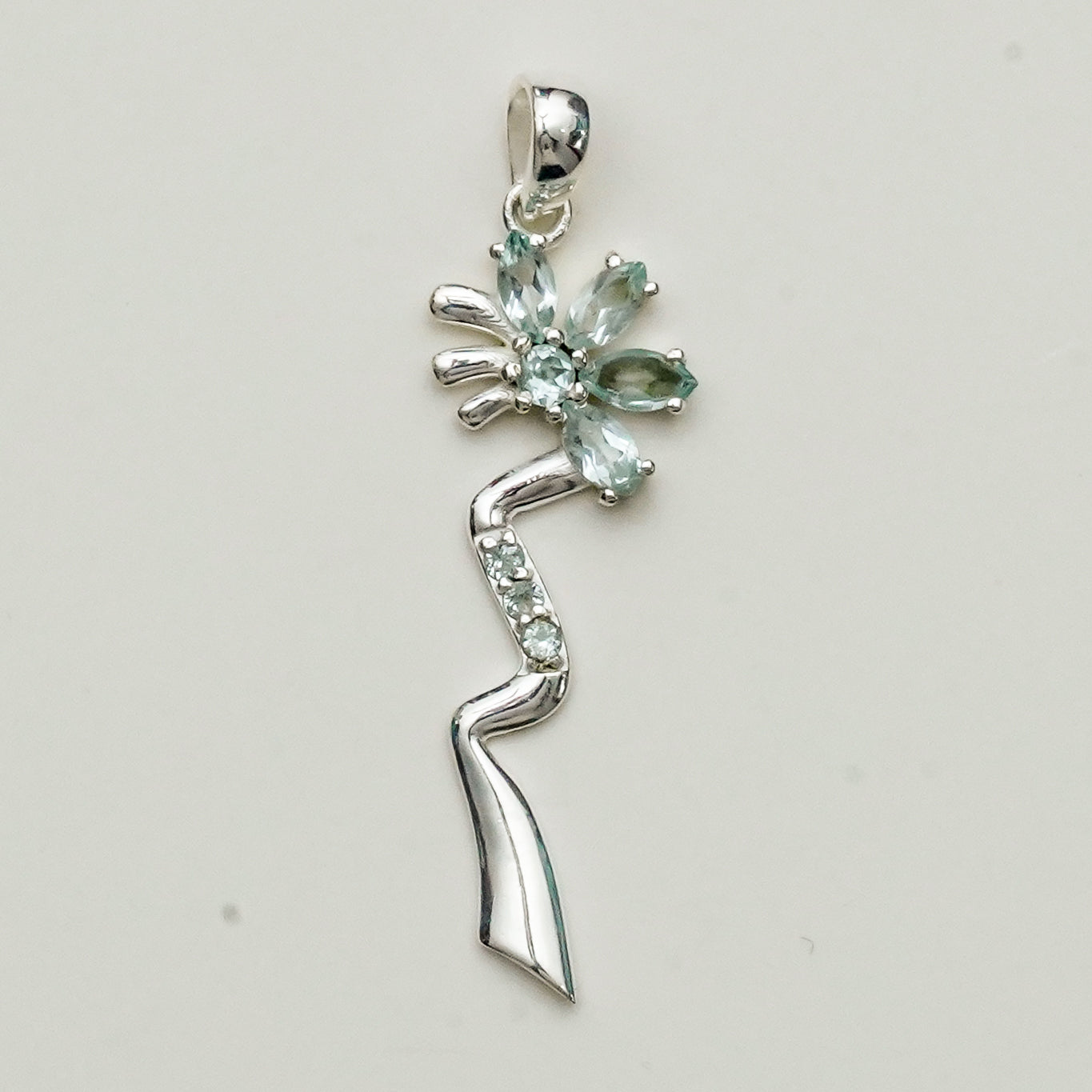 Modern Flower Pendent With Blue Topaz Gemstone In Solid Sterling Silver