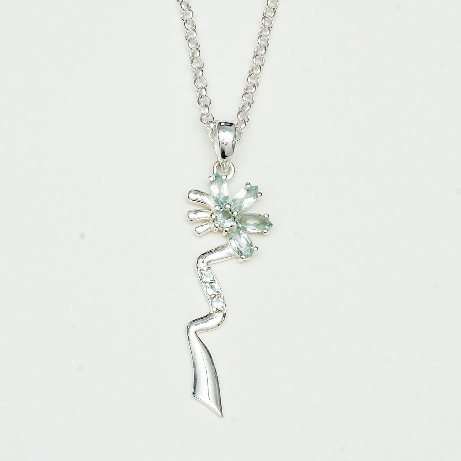 Modern Flower Pendent With Blue Topaz Gemstone In Solid Sterling Silver