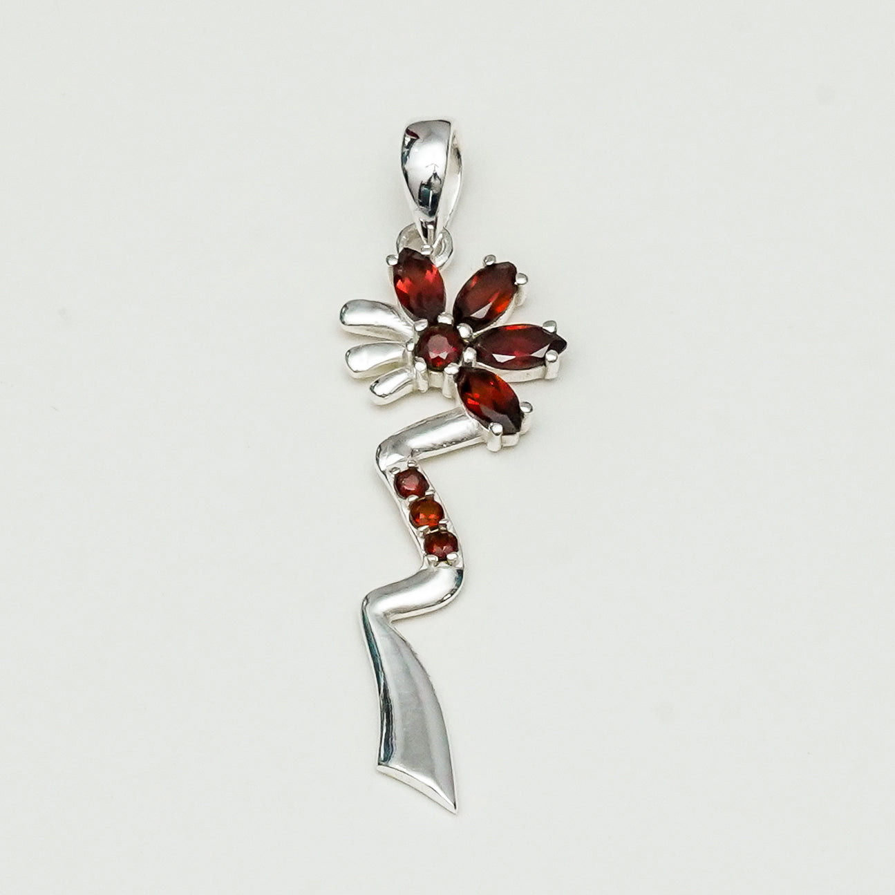 Modern Flower Pendent With Garnet Gemstone In Solid Sterling Silver