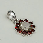Mohnaa Flower Pendant With Garnet Gemstone In Fine Sterling Silver