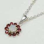 Mohnaa Flower Pendant With Garnet Gemstone In Fine Sterling Silver