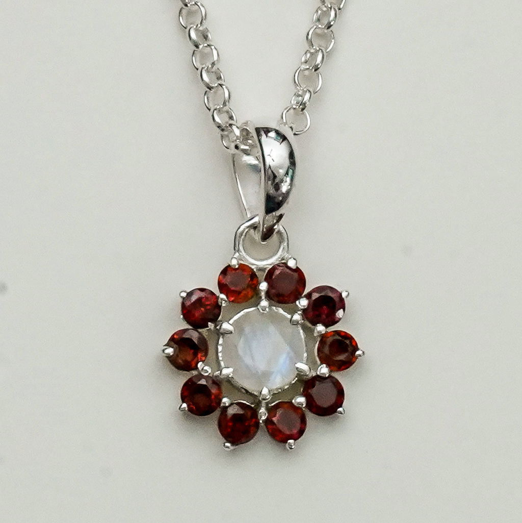 Mohnaa Flower Pendant With Garnet Gemstone In Fine Sterling Silver