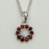 Mohnaa Flower Pendant With Garnet Gemstone In Fine Sterling Silver