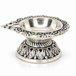 Top view of Mohnaa Shreepad sterling silver diya showing the decorative scalloped rim, polished inner bowl, and traditional ornamental design.