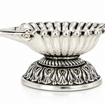 Mohnaa Shankhdeep 925 sterling silver shell diya featuring a fan-shaped ridged bowl, decorative pedestal, and polished silver finish on a white background.