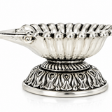 Mohnaa Shankhdeep 925 sterling silver shell diya featuring a fan-shaped ridged bowl, decorative pedestal, and polished silver finish on a white background.