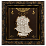 Shri Radha Krishna silver relief artwork with 999 SILVER inscription in an ornate black and gold decorative frame by Mohnaa Jewels