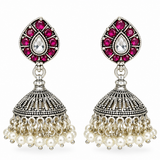 Mohnaa Rajnika 925 sterling silver jhumka earrings with ruby pink cubic zirconia accents, white pear-cut CZ centerpiece and pearl drop detailing.