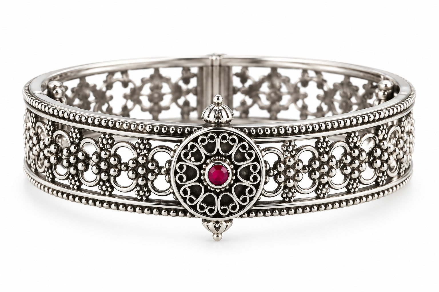 Rajnandini Filigree Kada handcrafted in 925 sterling silver with intricate openwork floral design and ruby-colored center stone.