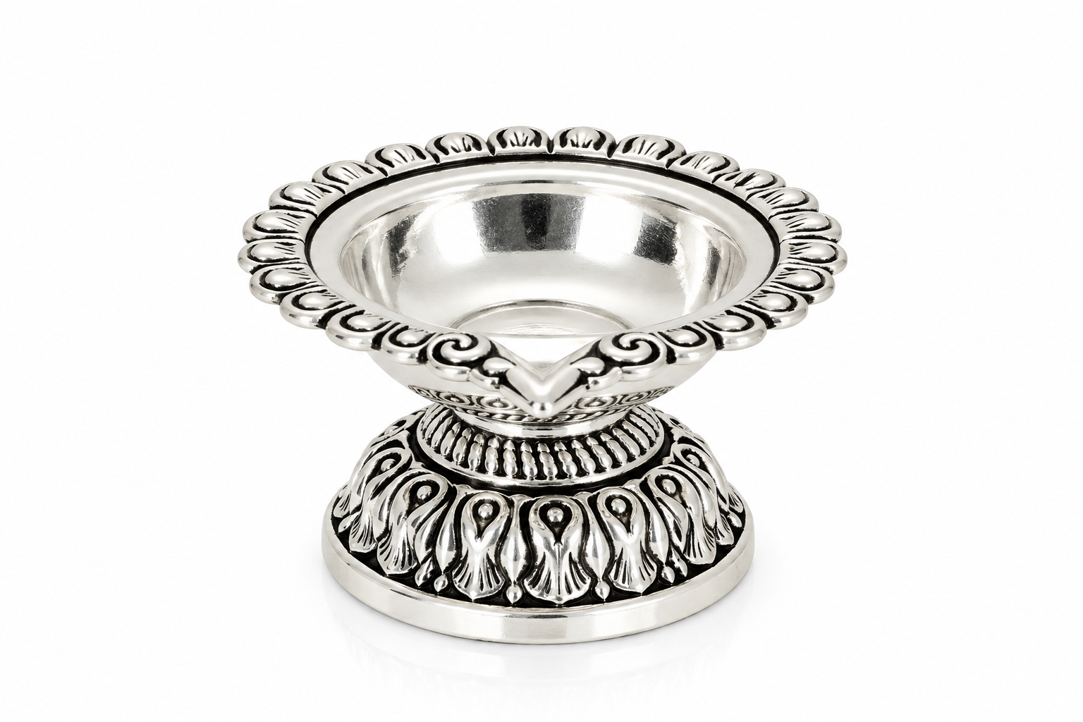 Top view of Mohnaa Shreekamal sterling silver diya showing its polished bowl and ornate scalloped rim with traditional decorative detailing.