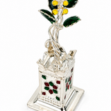 Mohnaa Tulsi Kyara 925 sterling silver decorative planter featuring a sculpted Tulsi plant, green leaves, yellow accents, and red and green floral motifs on a white background.