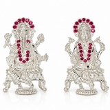 Pair of Mohnaa Jewels 925 sterling silver Lakshmi and Ganesha idols featuring pink stone embellished halos, intricate traditional detailing, and decorative pedestal bases on a white background.