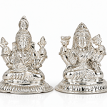 Silver-finish Goddess Lakshmi and Lord Ganesha idol set with intricate traditional detailing