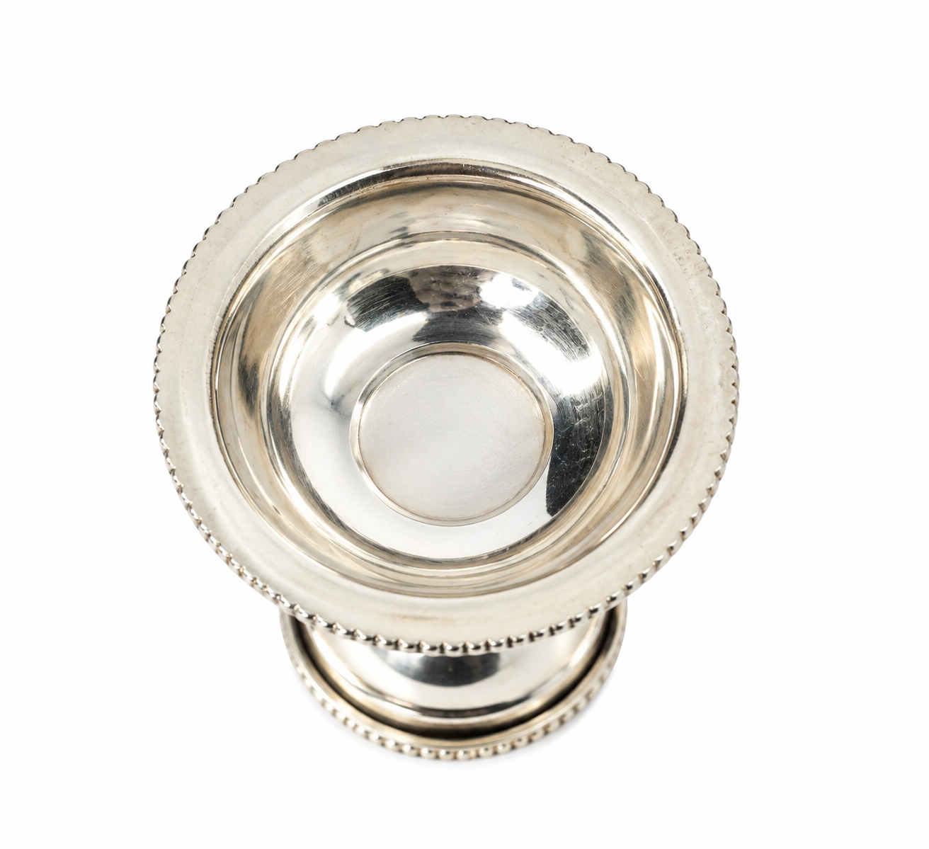Top view of Mohnaa Padmika sterling silver diya showing the smooth reflective bowl and decorative beaded rim.