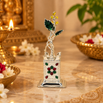 Mohnaa Tulsi Kyara silver decorative planter displayed in a traditional festive pooja setting.
