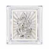 Silver-toned Lord Ganesha decorative relief artwork with a radiant patterned background inside a transparent rectangular display case