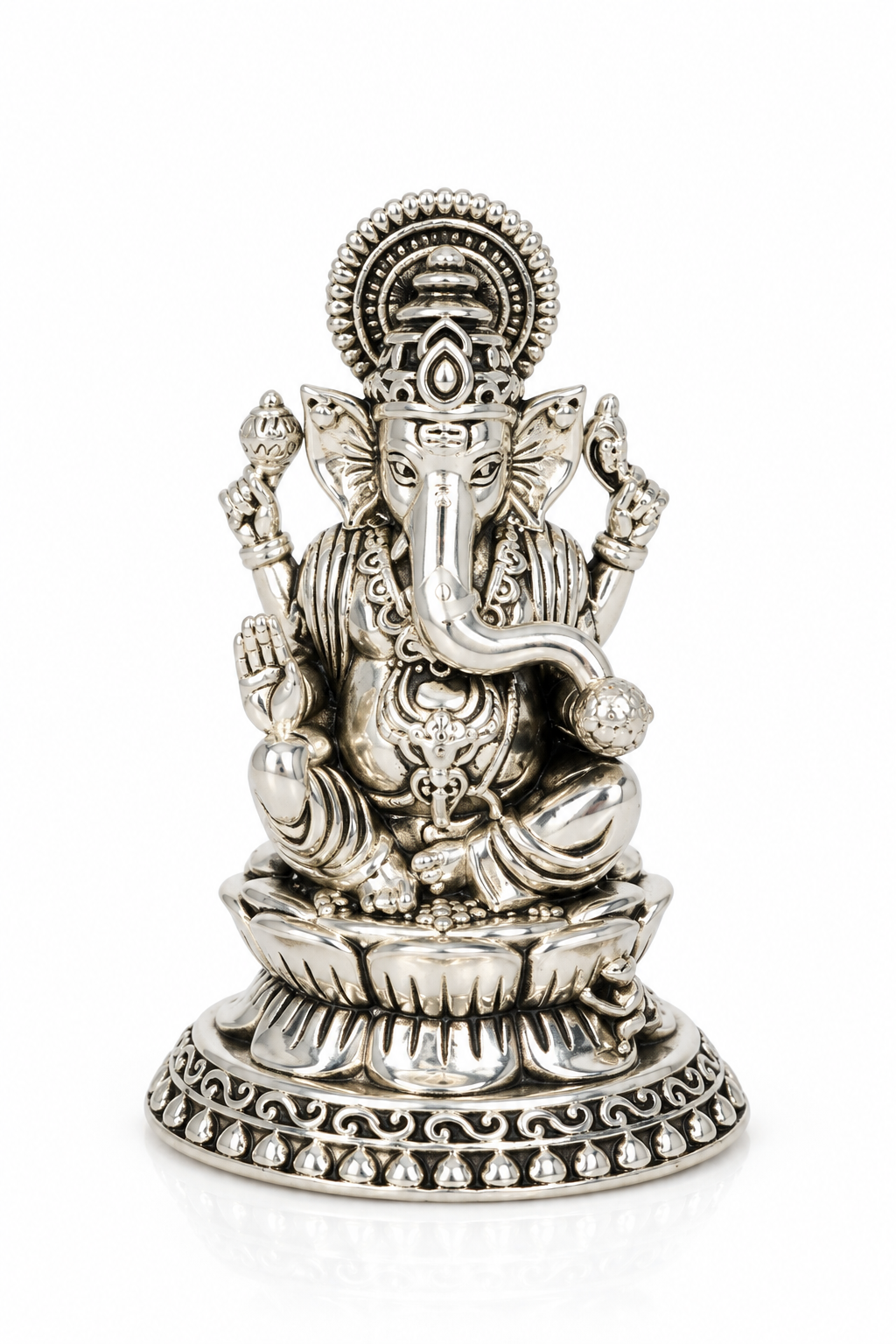 Traditional seated Lord Ganesha idol with ornate detailing and decorative lotus pedestal in silver finish