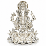Lord Ganesha seated on an elaborate lotus throne with an ornate crown and decorative halo in silver finish