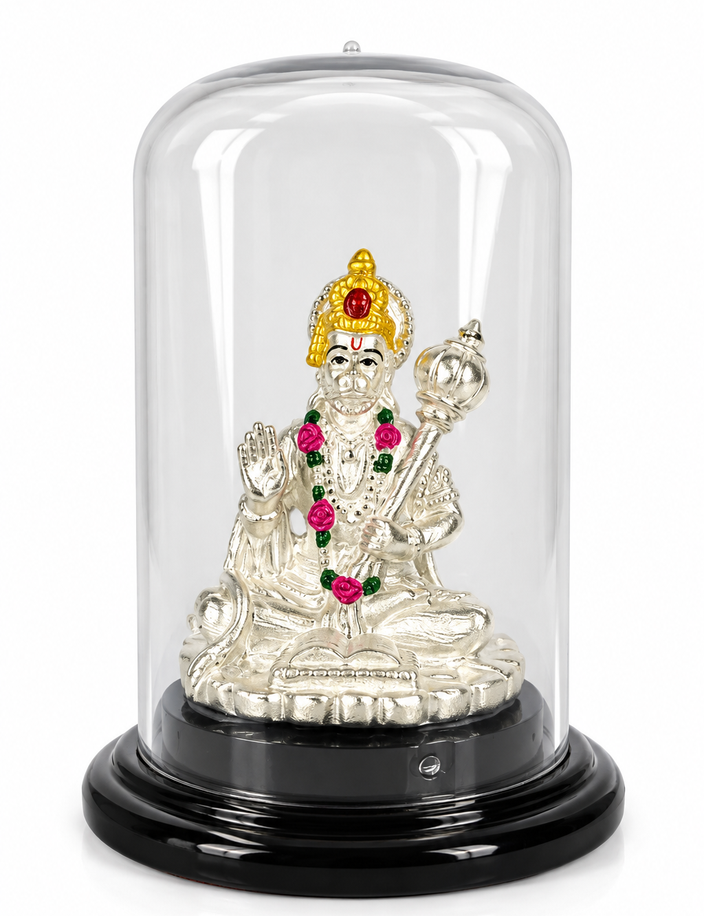Silver-plated seated Lord Hanuman idol with golden-toned crown and colourful garland under a transparent dome on a black base