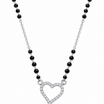 Mohnaa Hridaya 925 sterling silver mangalsutra featuring an open heart-shaped pendant with sparkling clear stones and a faceted black-bead chain on a white background.