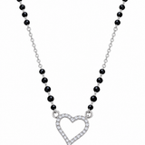Mohnaa Hridaya 925 sterling silver mangalsutra featuring an open heart-shaped pendant with sparkling clear stones and a faceted black-bead chain on a white background.