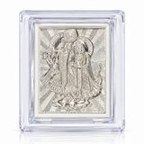 Intricately detailed silver-toned Radha Krishna raised-relief artwork with flute in a transparent rectangular display case