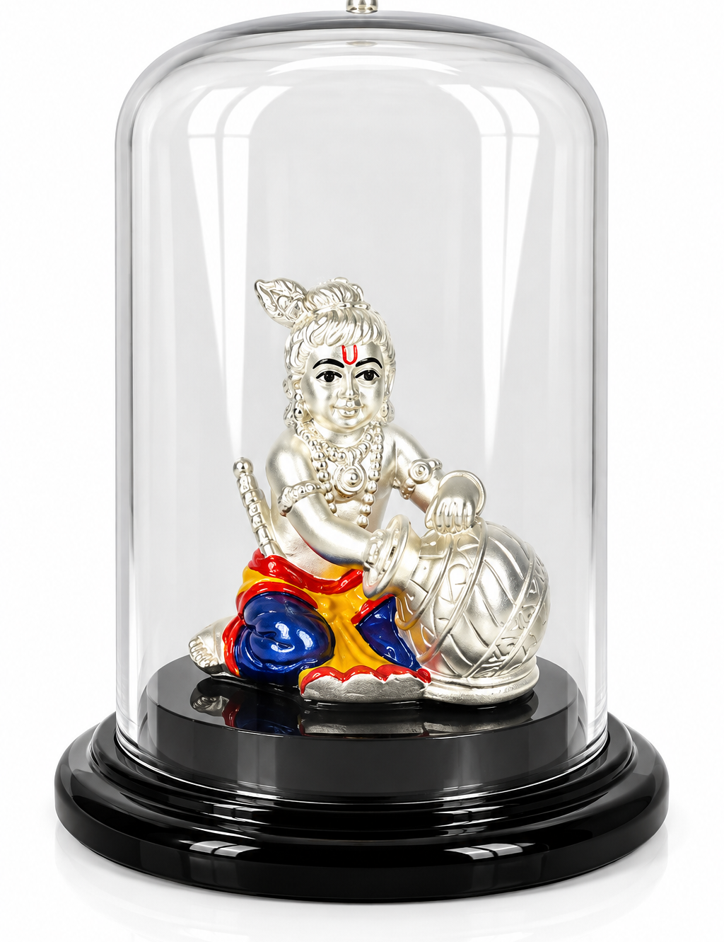 Silver-plated Bal Gopal idol with colourful traditional attire and butter pot under a transparent dome on a black base