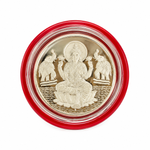 Silver Lakshmi coin featuring Goddess Lakshmi seated on a lotus with two elephants, presented in a red protective capsule by Mohnaa Jewels