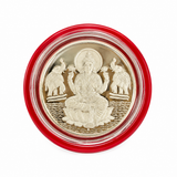 Silver Lakshmi coin featuring Goddess Lakshmi seated on a lotus with two elephants, presented in a red protective capsule by Mohnaa Jewels