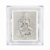 Goddess Lakshmi silver-tone embossed design in a transparent acrylic frame by Mohnaa Jewels