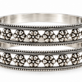 Handcrafted 925 sterling silver floral bangles pair featuring intricate flower motifs and openwork heritage design by Mohnaa Jewels