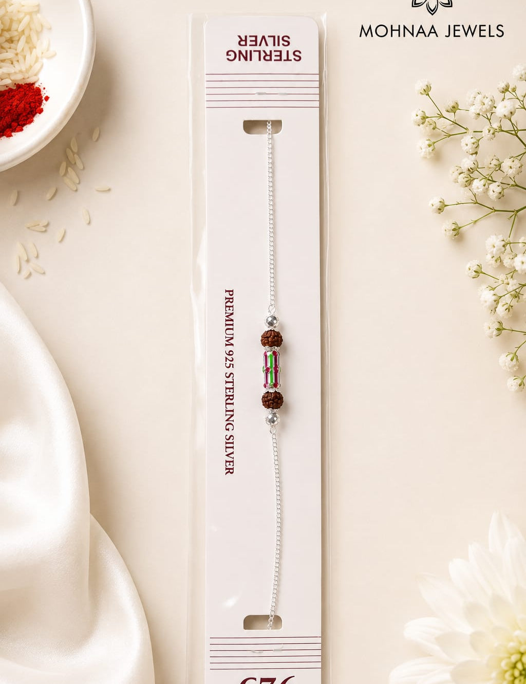 Rudra Shakti 925 Silver Rakhi featuring natural Rudraksha beads and a colorful centerpiece on a sterling silver chain, displayed in premium Mohnaa Jewels packaging.