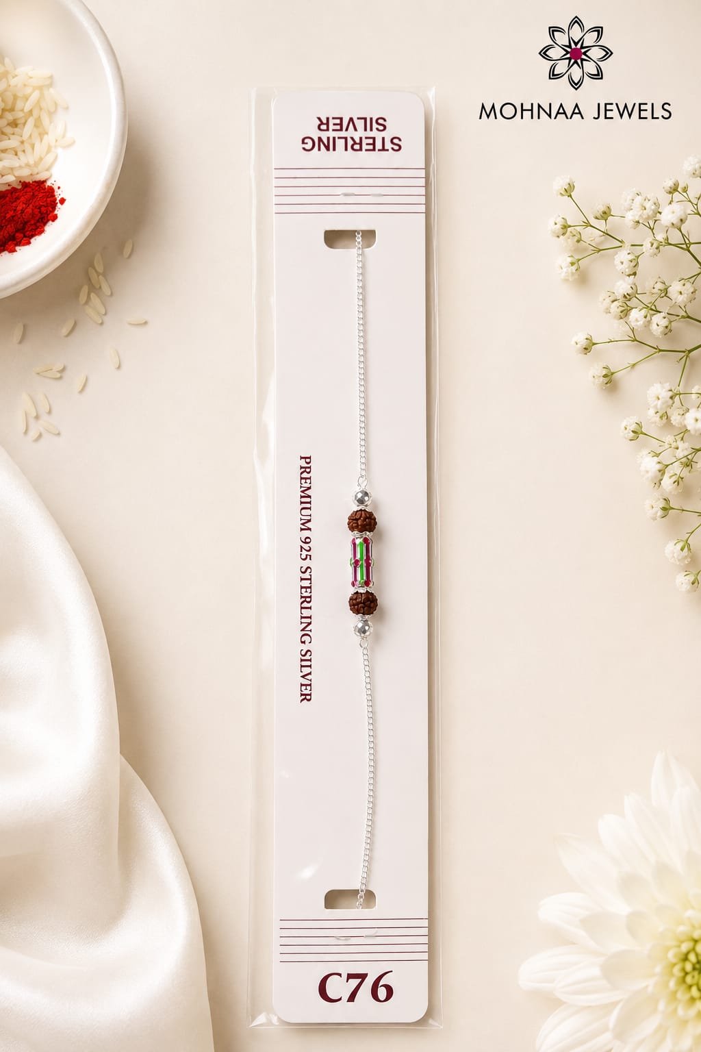 Rudra Shakti 925 Silver Rakhi featuring natural Rudraksha beads and a colorful centerpiece on a sterling silver chain, displayed in premium Mohnaa Jewels packaging.