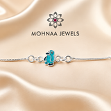 Cute blue penguin charm 925 sterling silver rakhi bracelet with adjustable silver chain by Mohnaa Jewels