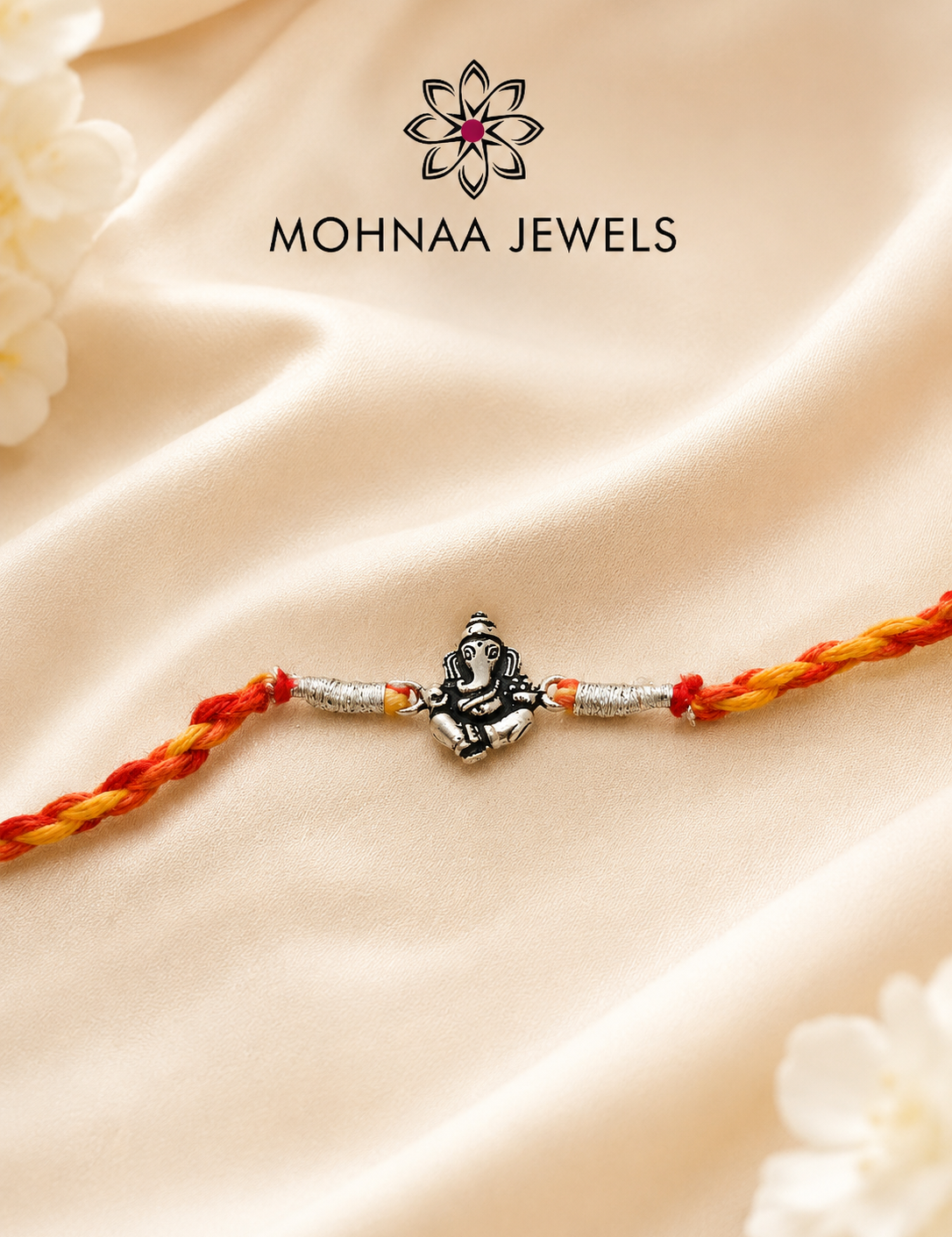 Vighnaharta Ganesh 925 Sterling Silver Rakhi featuring detailed Lord Ganesha motif with handcrafted saffron and red thread by Mohnaa Jewels