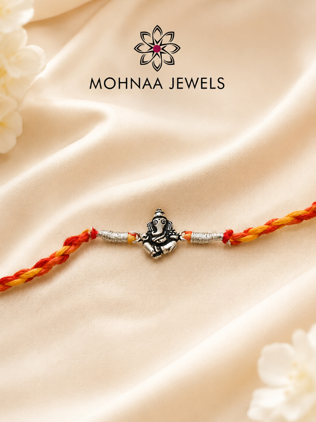 Vighnaharta Ganesh 925 Sterling Silver Rakhi featuring detailed Lord Ganesha motif with handcrafted saffron and red thread by Mohnaa Jewels